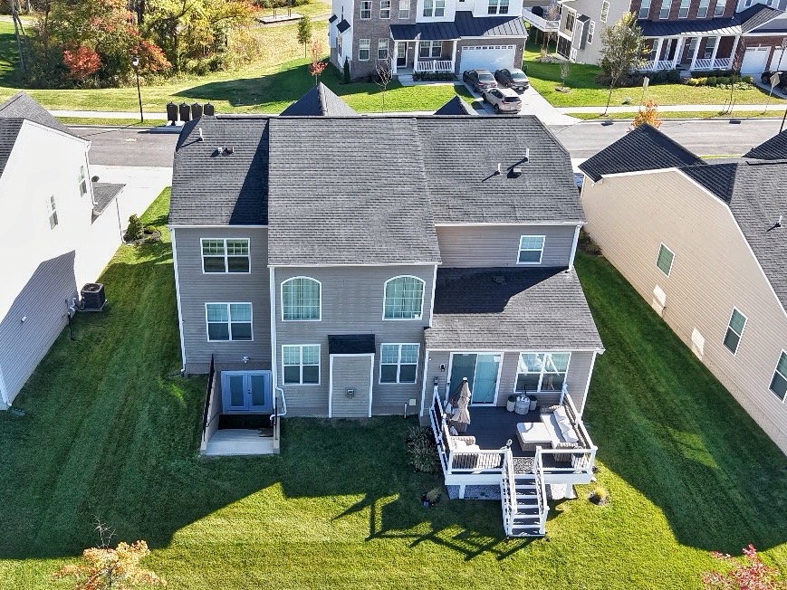 Rear facade of the Glenn Dale home with a deck and walkout lower level